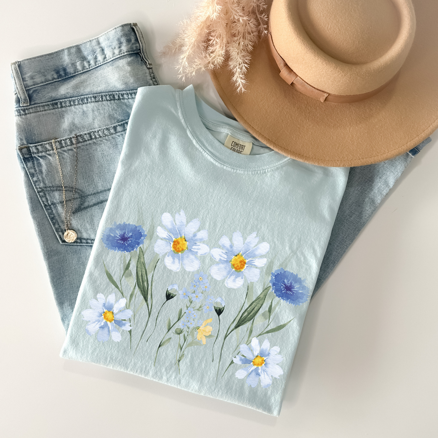 Fresh spring and summer t-shirts with floral, pastel, and beachy vibes. Lightweight, comfy styles perfect for sunny days, picnics, vacations, and everyday fun.