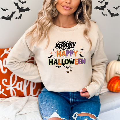 Person wearing a Halloween-themed sweatshirt with pumpkins and bats in the background.