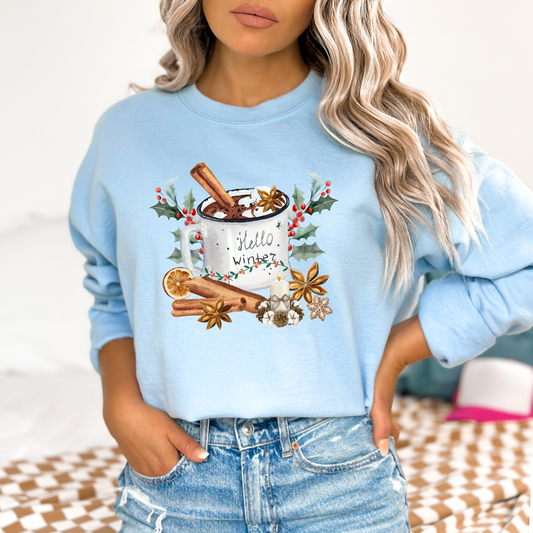 Light blue sweatshirt with winter-themed design worn by a person.