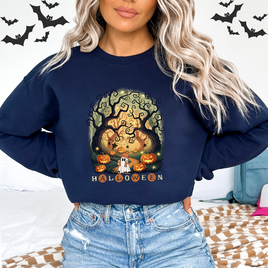 Person wearing a navy blue sweatshirt with A retro-style illustration featuring two friendly white ghosts surrounded by autumn-colored flowers and greenery. A pink butterfly is on one ghost's head. The text "SPOOKY VIBES" is in a bold, wavy font above them, with a flower that has a jack-o'-lantern face.