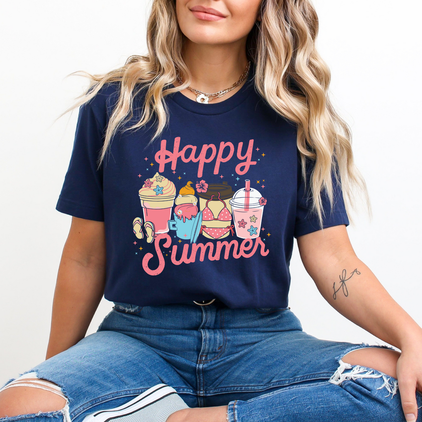 A colorful retro-style graphic t-shirt featuring a vibrant summer drink cup and “Happy Summer Vibes” text, styled in a playful and sunny summer outfit perfect for beach days or festivals.