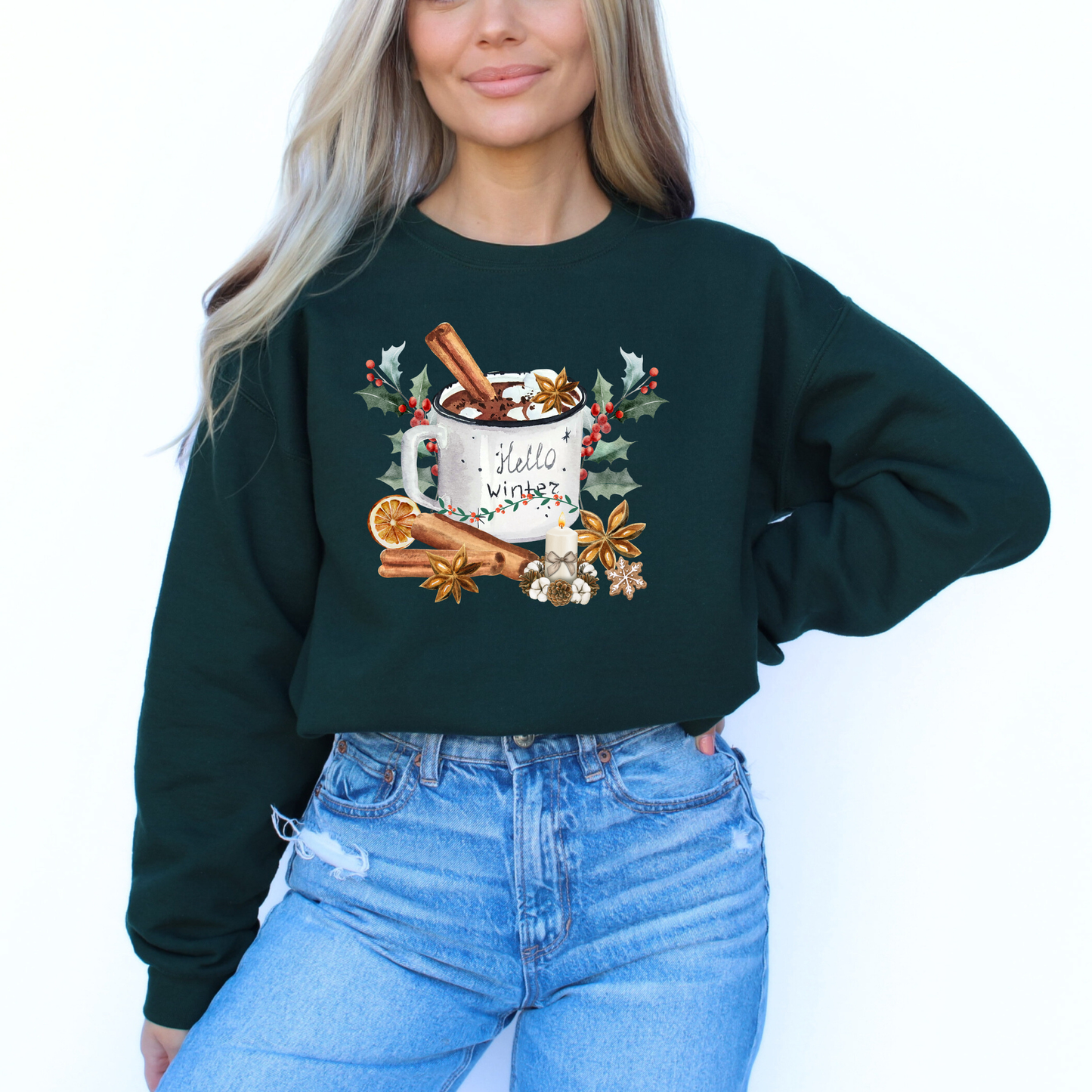 Person wearing a dark green sweatshirt with a festive design on a white background