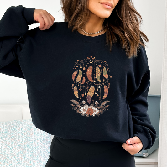 Person wearing a black sweatshirt with a colorful dreamcatcher design. Autumn Sweater

Fall Colors

Harvest Design

Rust Orange

Olive Green

Woodland Theme

Thanksgiving Shirt

Cozy Fall Apparel